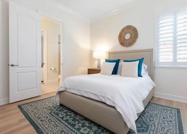 a bedroom with a bed and a table in it