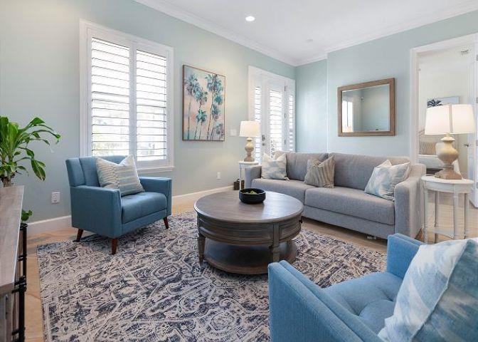 503 Cinnamon Beach Lane Palm Coast, FL 32137 - Photo 42 of 50 a living room with furniture and a large window