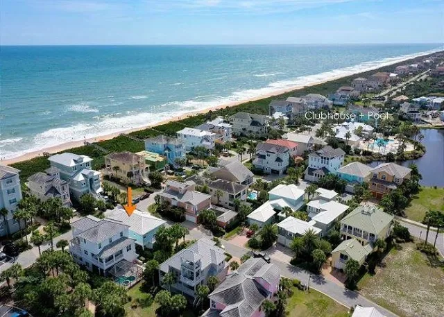 an aerial view of a house with outdoor space