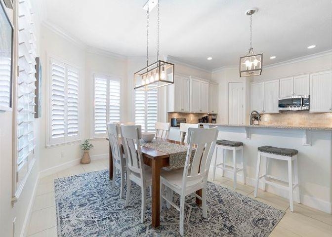 503 Cinnamon Beach Lane Palm Coast, FL 32137 - Photo 9 of 50 a view of a dining room with furniture window and outside view