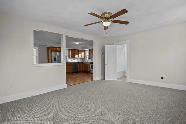 a kitchen with stainless steel appliances granite countertop a refrigerator stove top oven and sink
