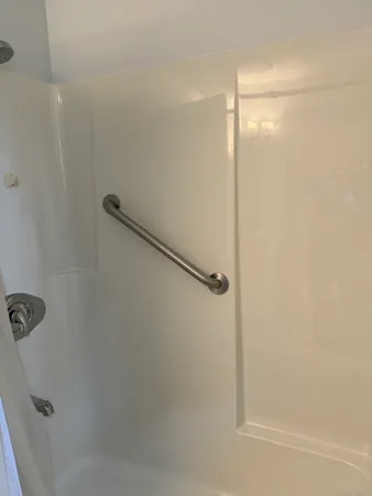 a bathroom with a glass shower door