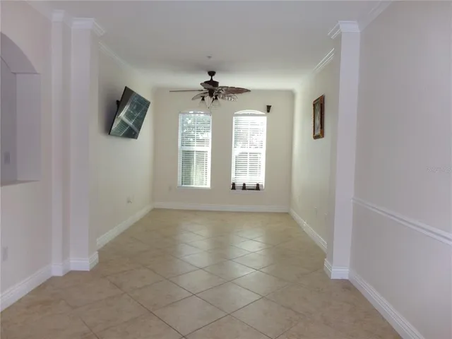 a view of a livingroom with furniture window and wooden floor