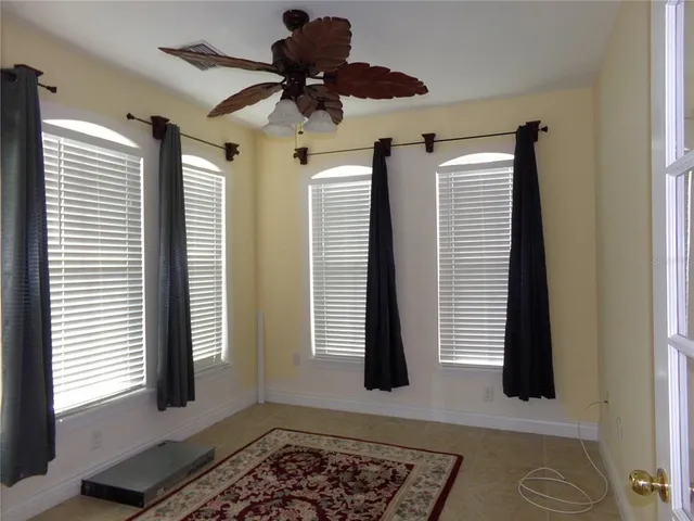 a view of balcony and dining room with furniture