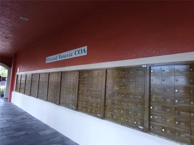 a living room with a table chairs and a flat screen tv
