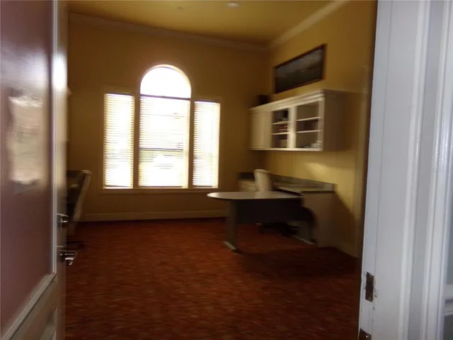 a front view of a house with outdoor seating