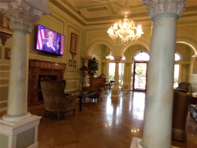 a view of a hallway to rooms