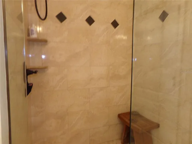 a front view of multi story residential houses with yard and green space