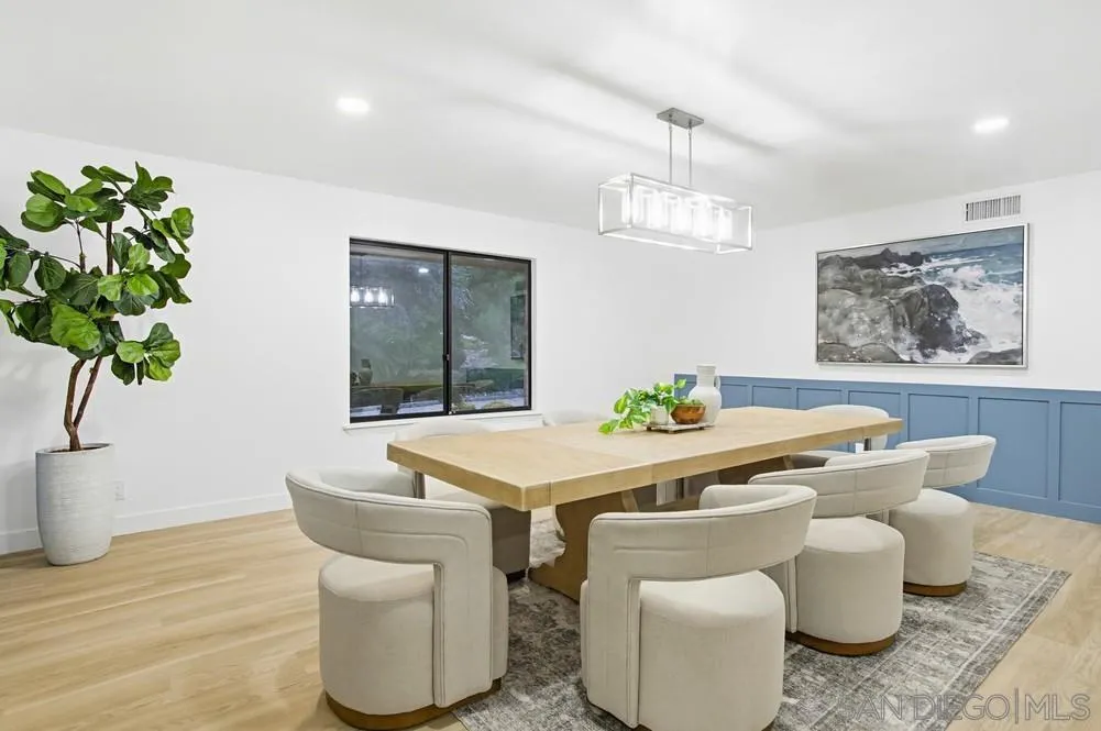3725 Via Cielo Azul Alpine, CA 91901 - Photo 20 of 43 a dining room with furniture potted plants and wooden floor