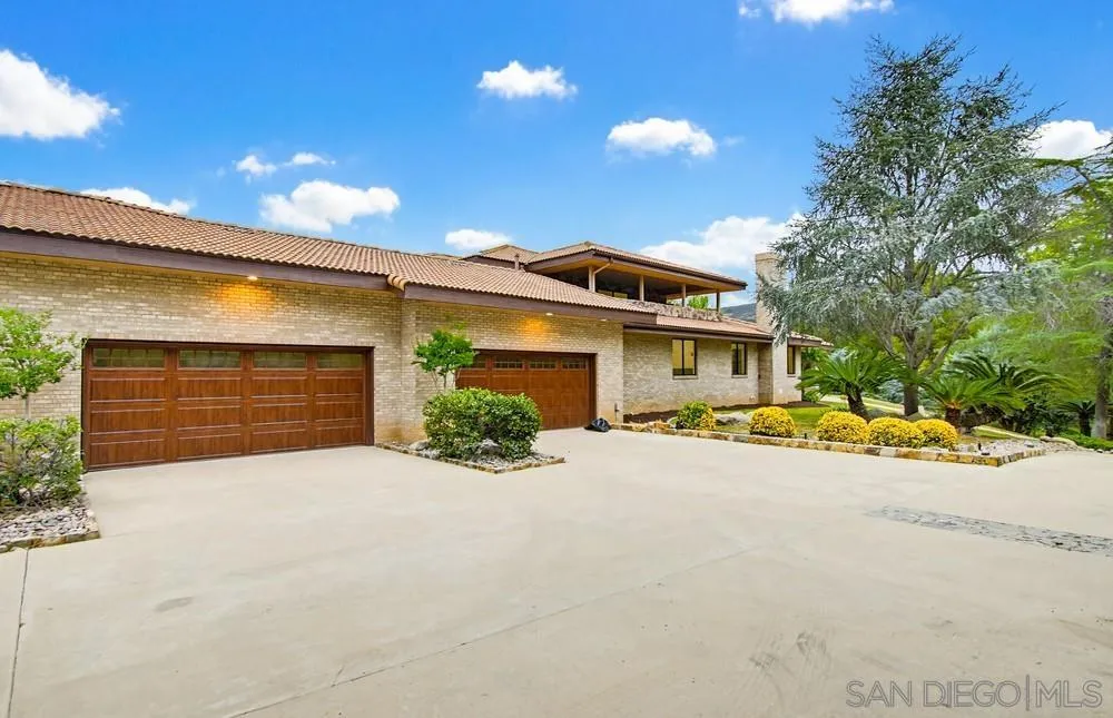 3725 Via Cielo Azul Alpine, CA 91901 - Photo 22 of 43 a view of a house with potted plants and a large parking space