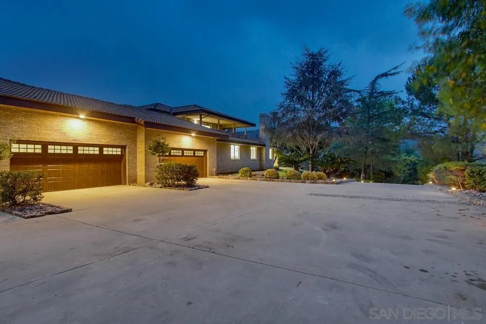 3725 Via Cielo Azul Alpine, CA 91901 - Photo 23 of 43 a street view with a building and trees in the background