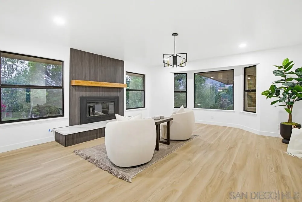 3725 Via Cielo Azul Alpine, CA 91901 - Photo 24 of 43 a living room with furniture and a fireplace