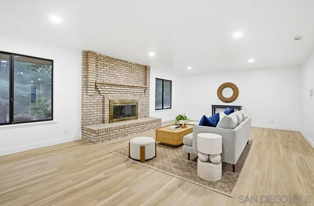 3725 Via Cielo Azul Alpine, CA 91901 - Photo 25 of 43 a living room with furniture and a fireplace