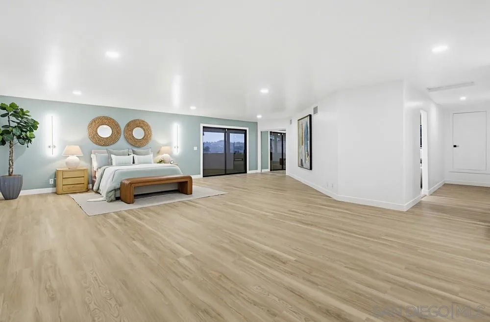 3725 Via Cielo Azul Alpine, CA 91901 - Photo 31 of 43 a spacious bedroom with a bed and a lamp
