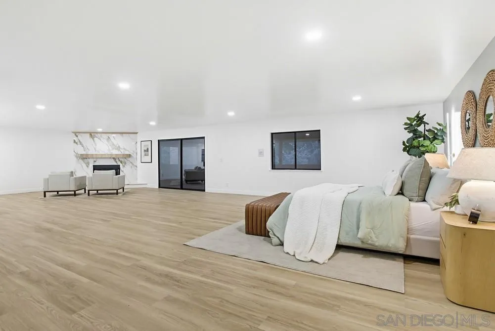 3725 Via Cielo Azul Alpine, CA 91901 - Photo 32 of 43 a spacious bedroom with a bed and a couch