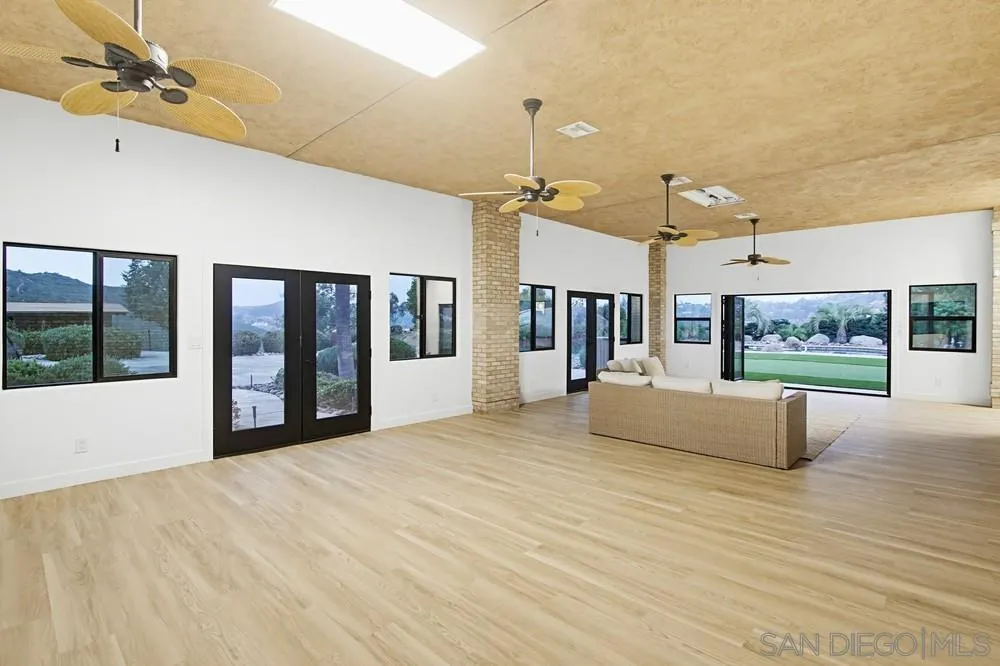 3725 Via Cielo Azul Alpine, CA 91901 - Photo 6 of 43 a view of an empty room with window and a kitchen