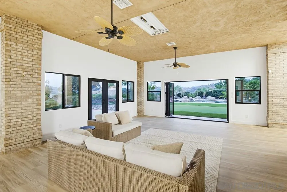 3725 Via Cielo Azul Alpine, CA 91901 - Photo 7 of 43 a living room with furniture and a large window