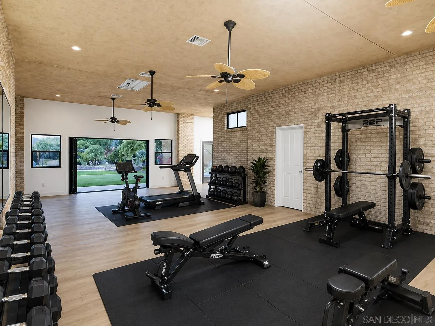 3725 Via Cielo Azul Alpine, CA 91901 - Photo 8 of 43 a room with gym equipment and large windows