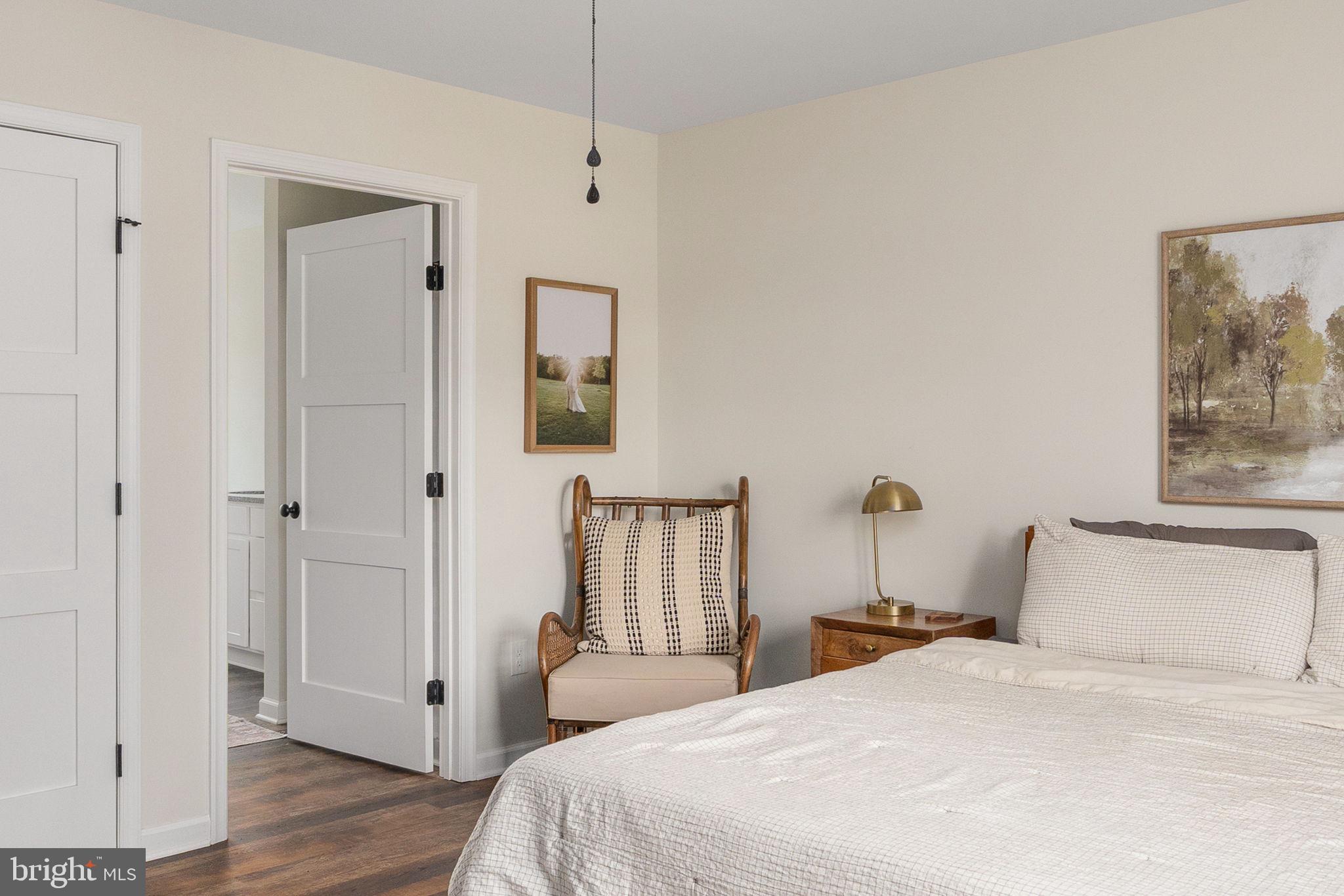 158 Red Hill Road Orange, VA 22960 - Photo 24 of 54 a bedroom with a bed and a painting on the wall