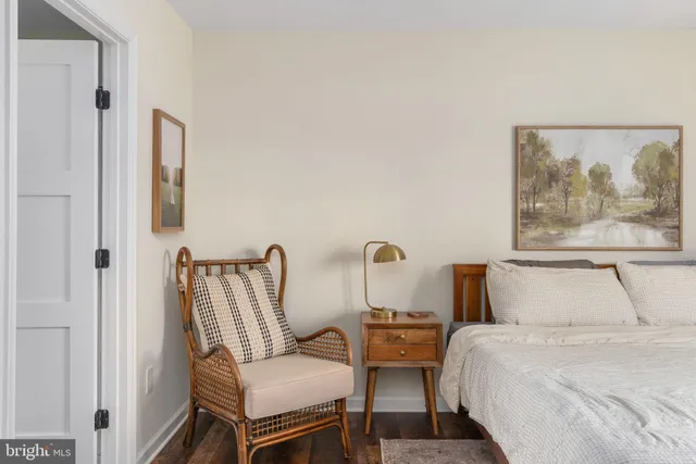 a white bath tub sitting in a bathroom next to a window