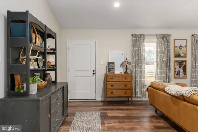 a bedroom with furniture and a window