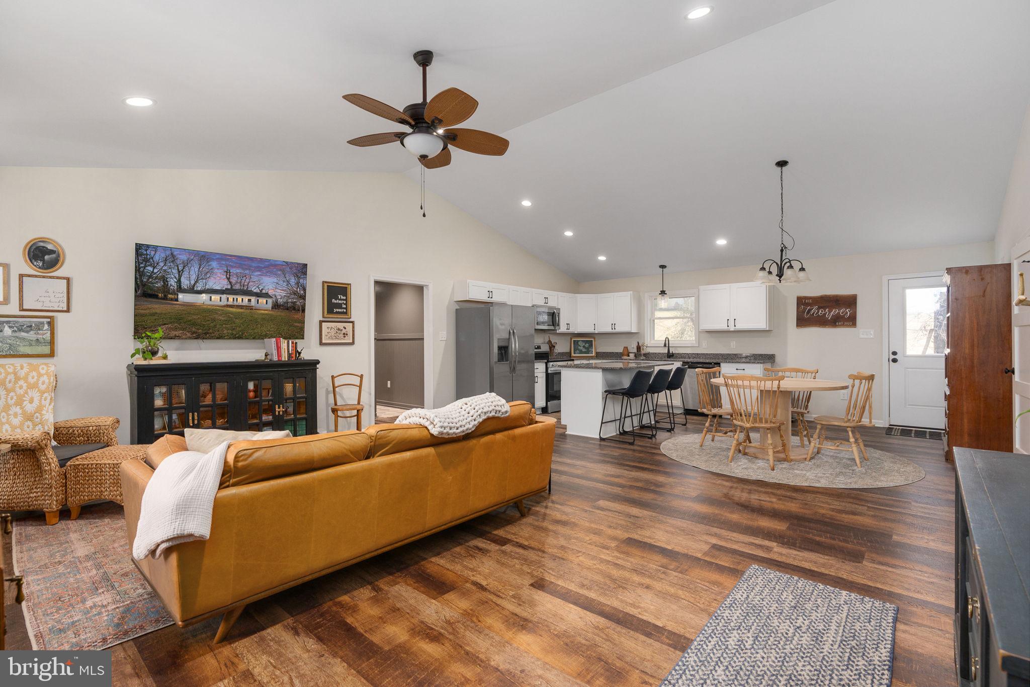 158 Red Hill Road Orange, VA 22960 - Photo 10 of 54 a living room with furniture kitchen view and a chandelier