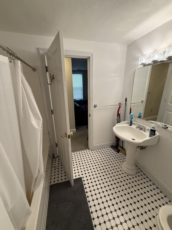 190 L Street, Unit 2 Boston, MA 02127 - Photo 13 of 15 a bathroom with a sink toilet and shower