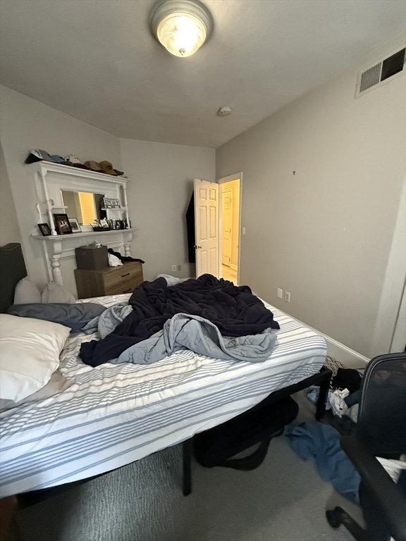 190 L Street, Unit 2 Boston, MA 02127 - Photo 8 of 15 a bedroom with a bed and a window