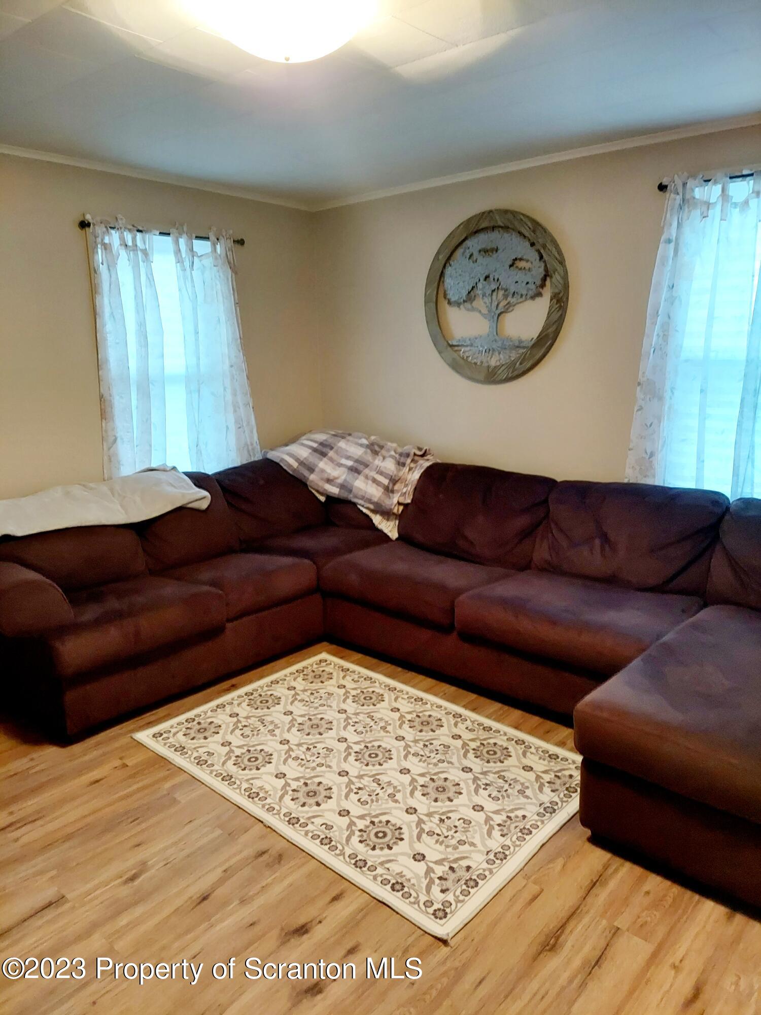 214 Cherry Street Dunmore, PA 18512 - Photo 20 of 58 a living room with a couch and a coffee table