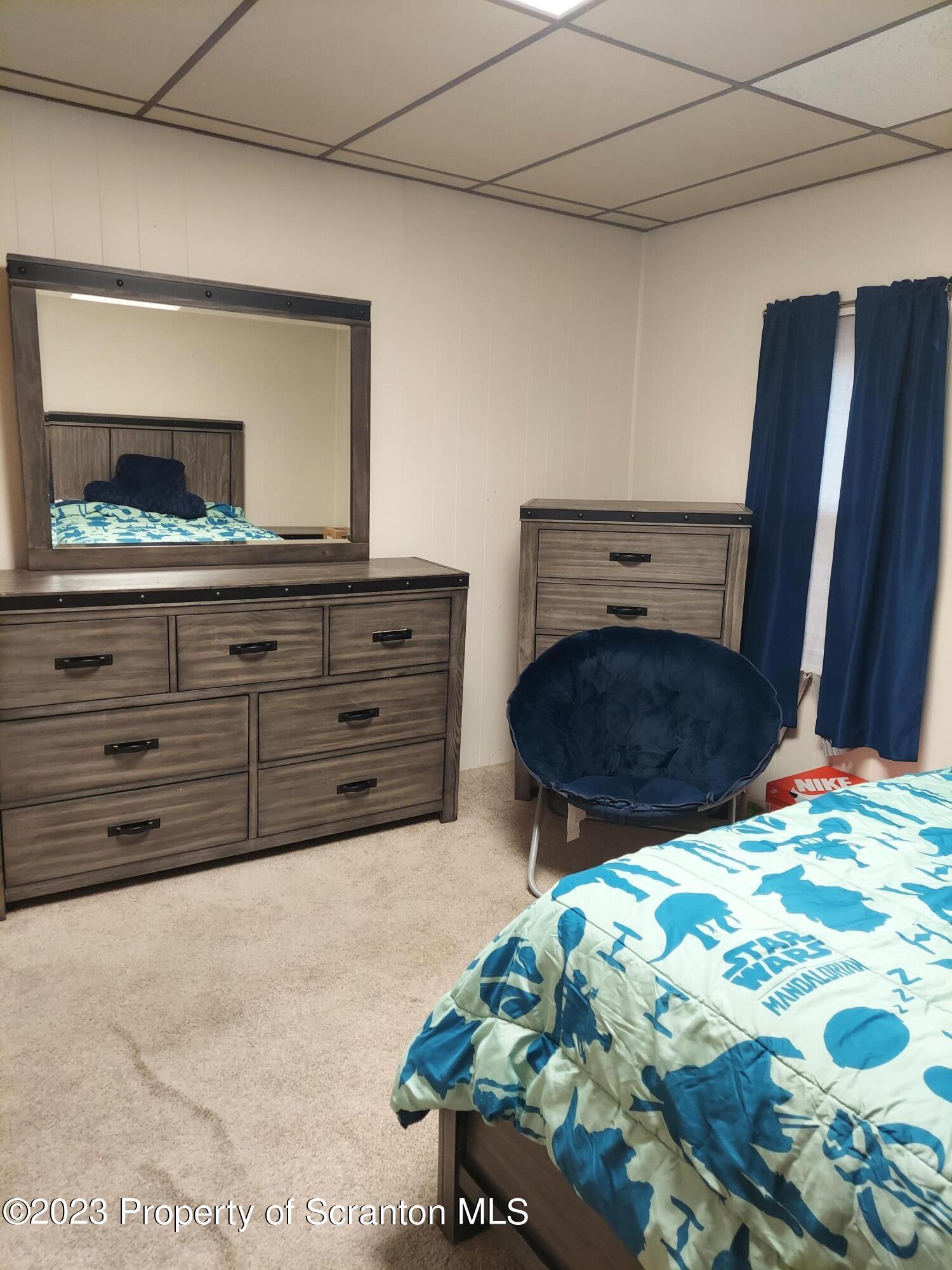214 Cherry Street Dunmore, PA 18512 - Photo 27 of 58 a bedroom with a bed and a dresser