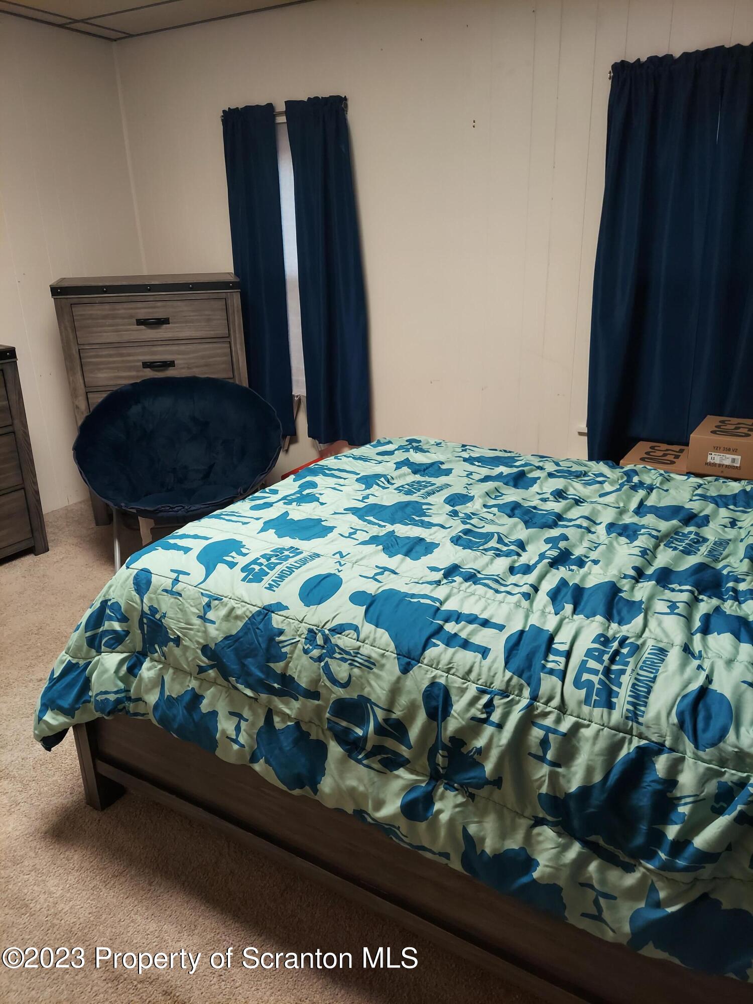 214 Cherry Street Dunmore, PA 18512 - Photo 28 of 58 a bedroom with a bed and a dresser