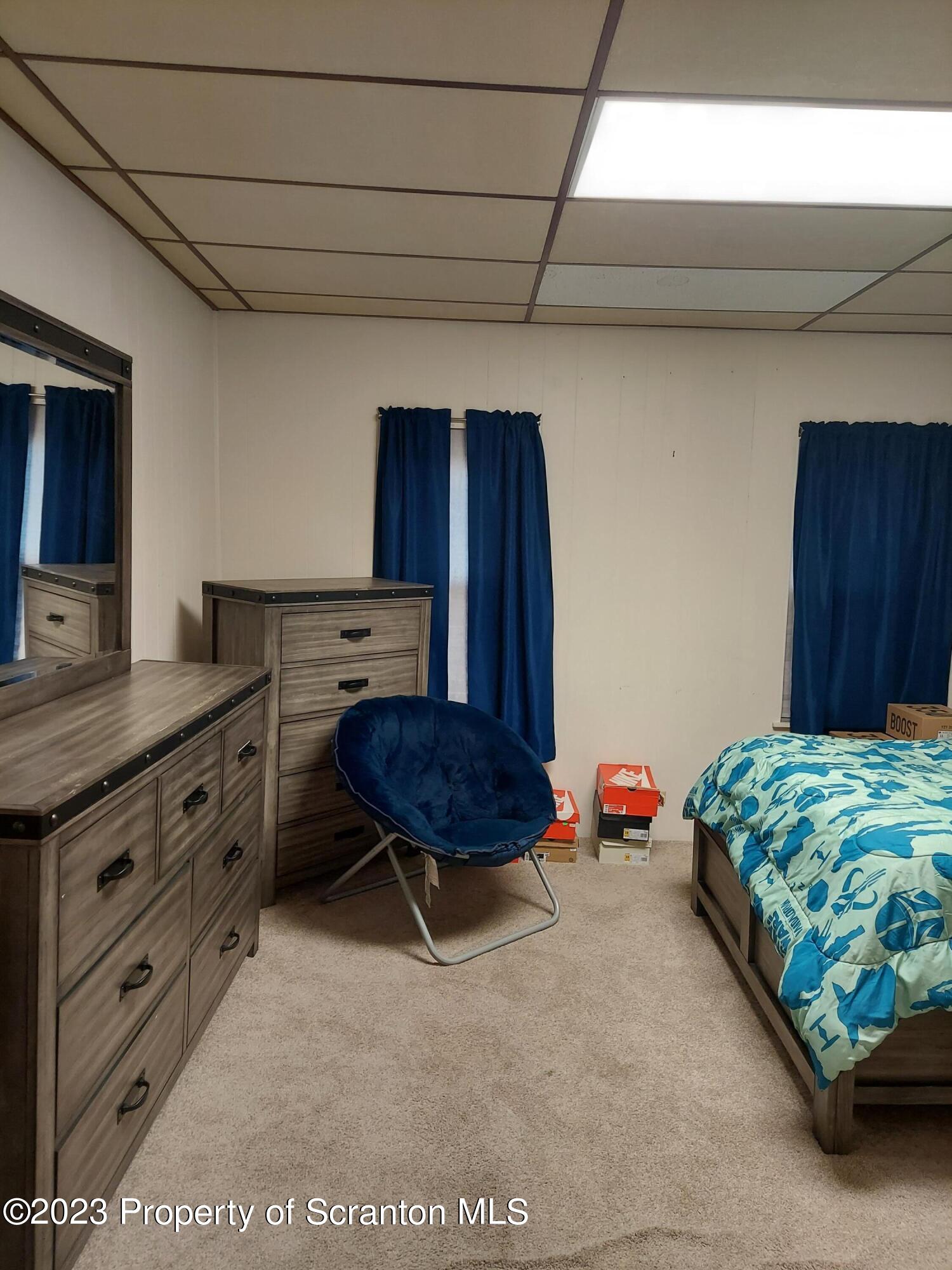 214 Cherry Street Dunmore, PA 18512 - Photo 29 of 58 a bedroom with furniture and a dresser