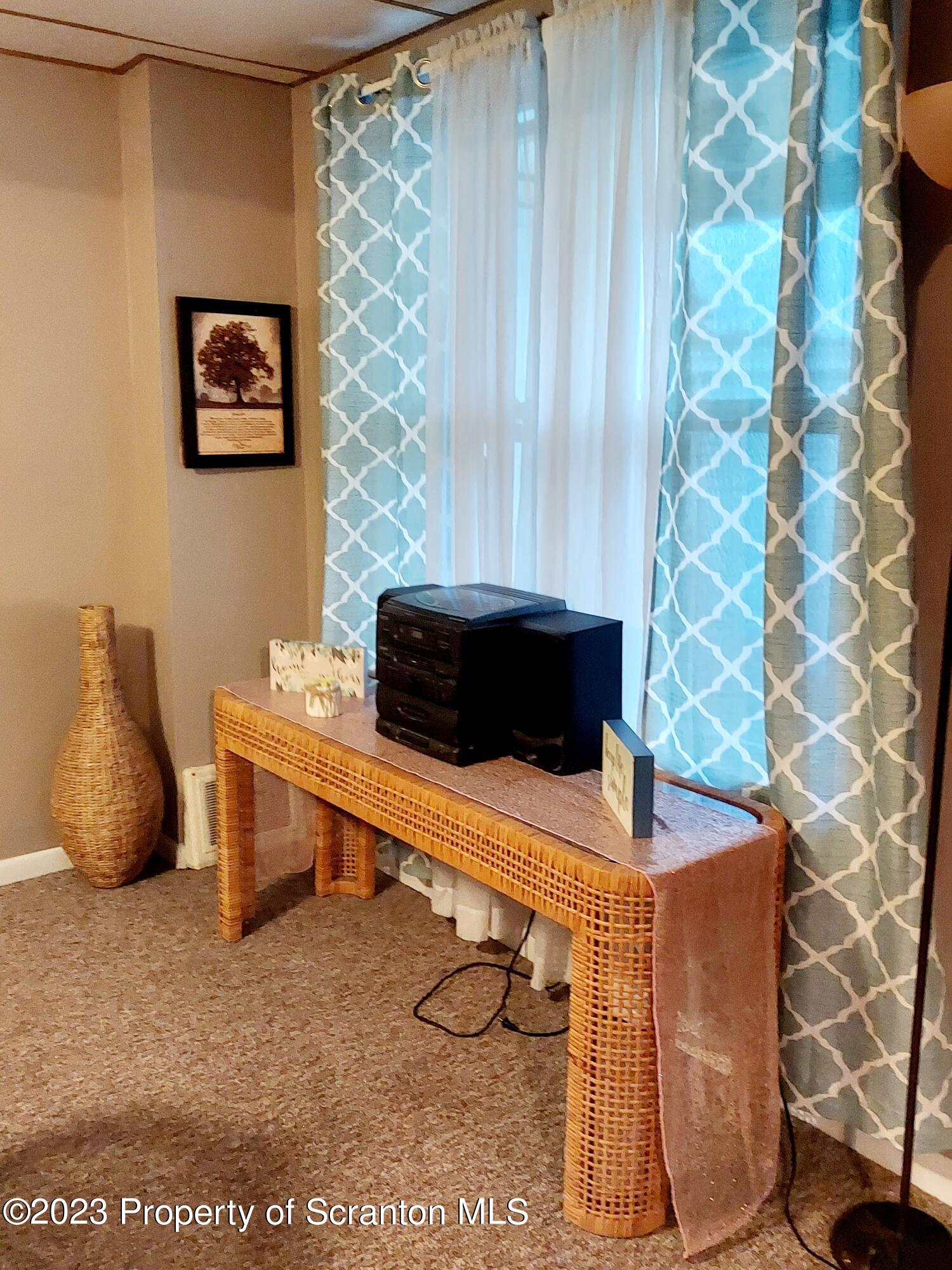 214 Cherry Street Dunmore, PA 18512 - Photo 34 of 58 a room with a table and a chair