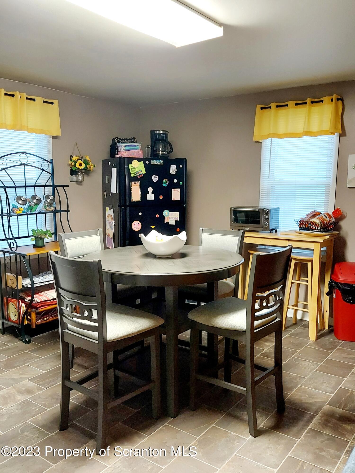 214 Cherry Street Dunmore, PA 18512 - Photo 38 of 58 a view of a dining room with furniture and window