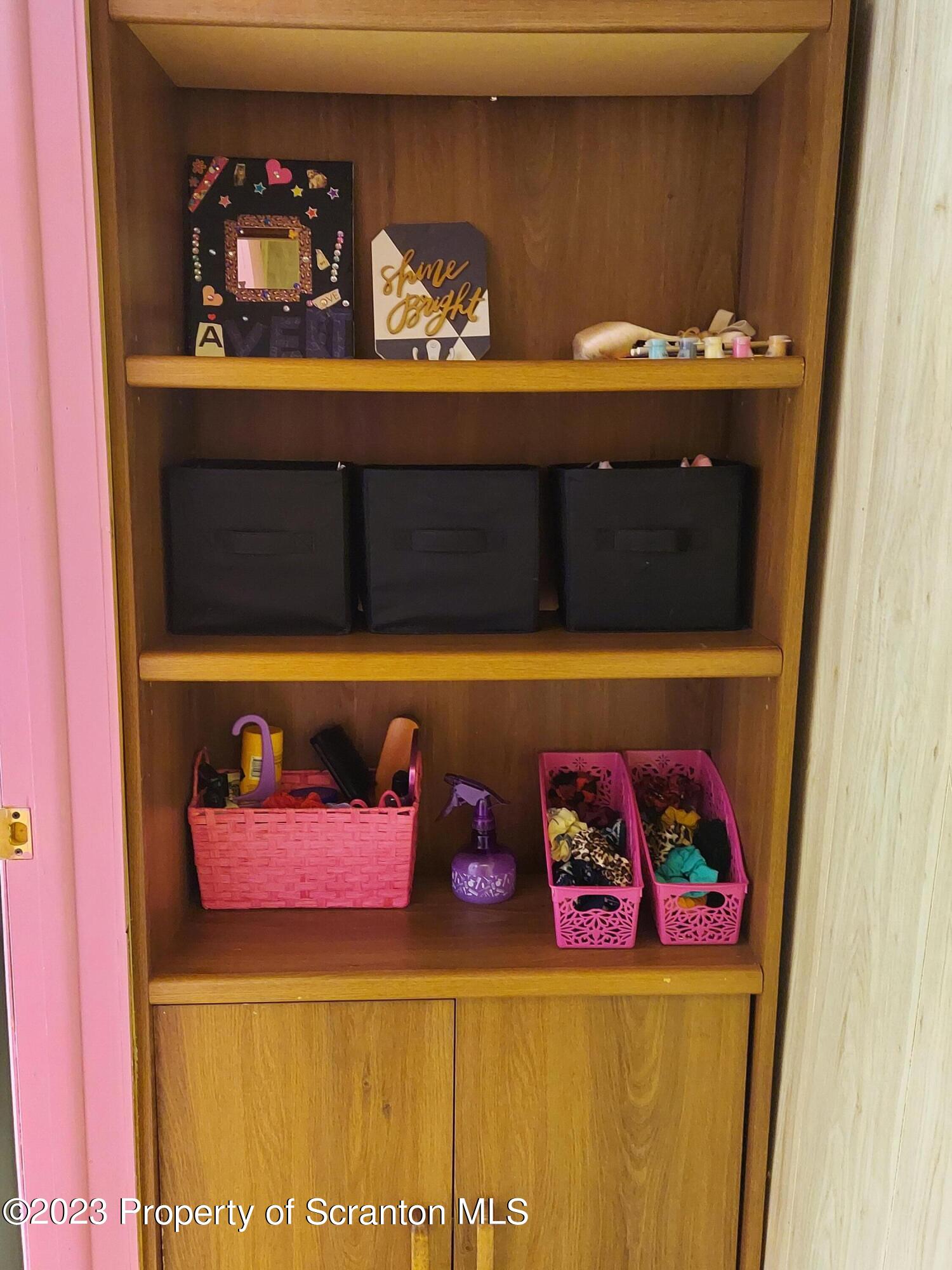 214 Cherry Street Dunmore, PA 18512 - Photo 41 of 58 a picture of a book shelf