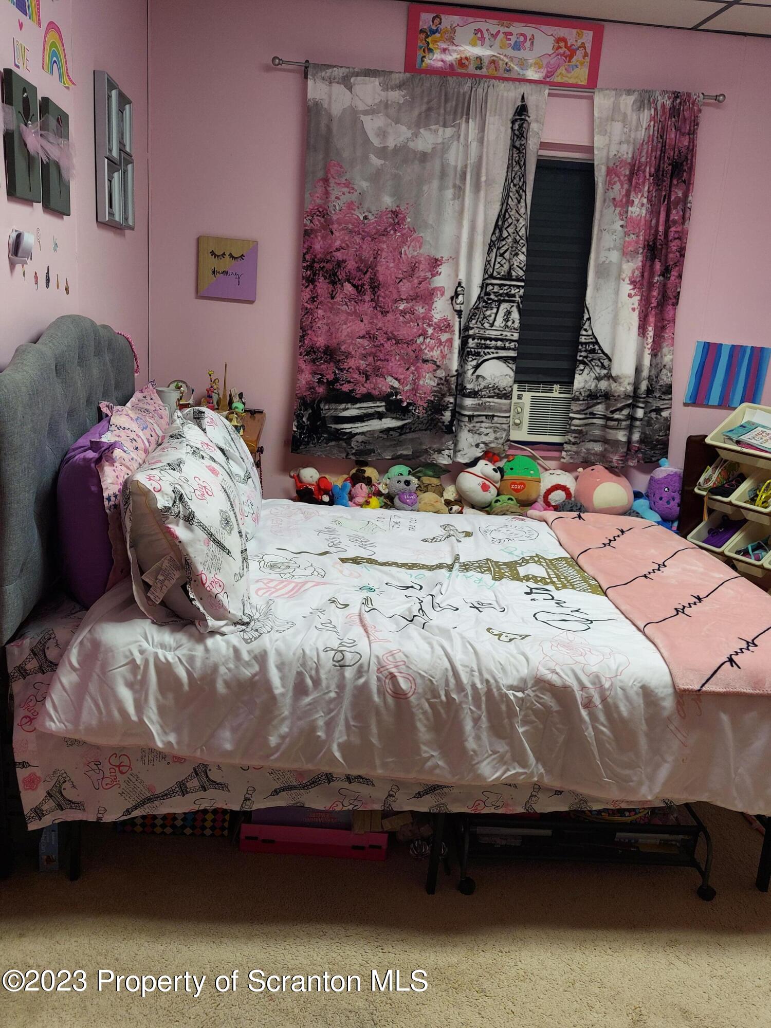214 Cherry Street Dunmore, PA 18512 - Photo 42 of 58 a bedroom with bed and a painting on the wall