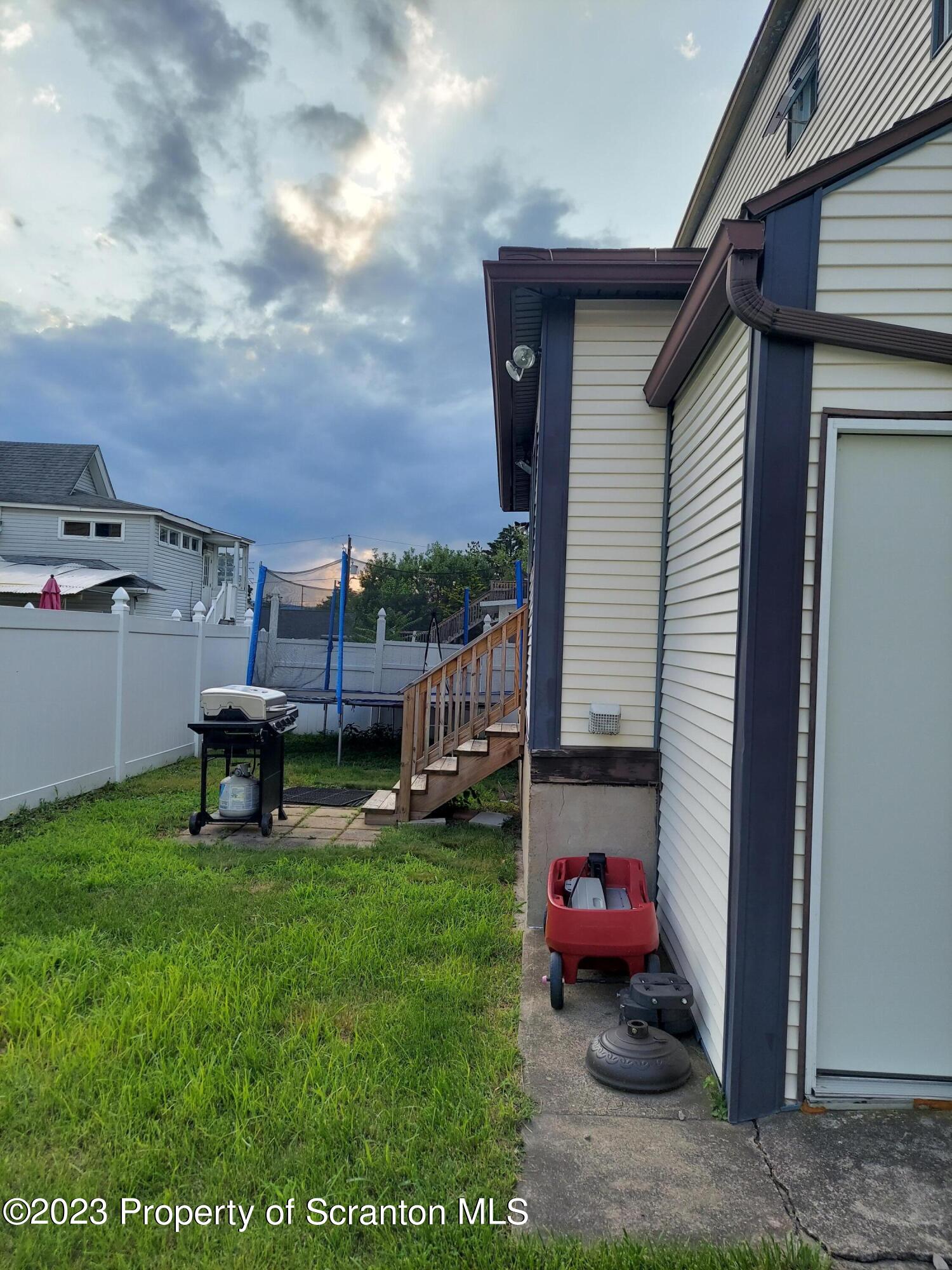 214 Cherry Street Dunmore, PA 18512 - Photo 5 of 58 a view of a backyard with sitting area