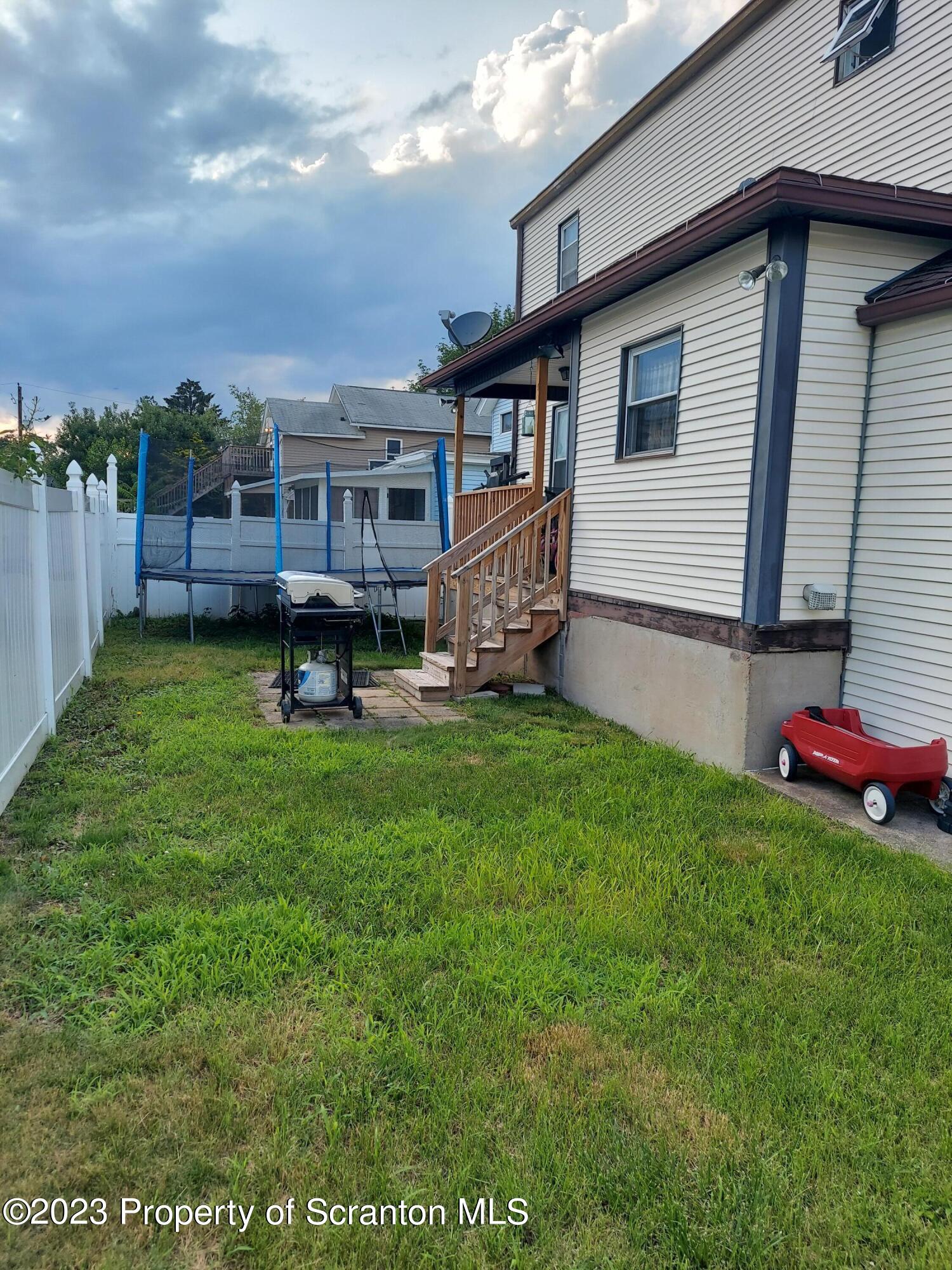 214 Cherry Street Dunmore, PA 18512 - Photo 6 of 58 a view of a house with backyard and sitting area