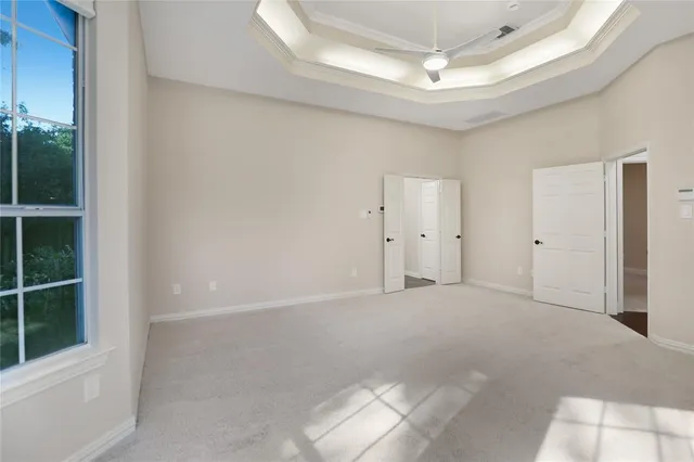 a view of cabinets and utility room with window