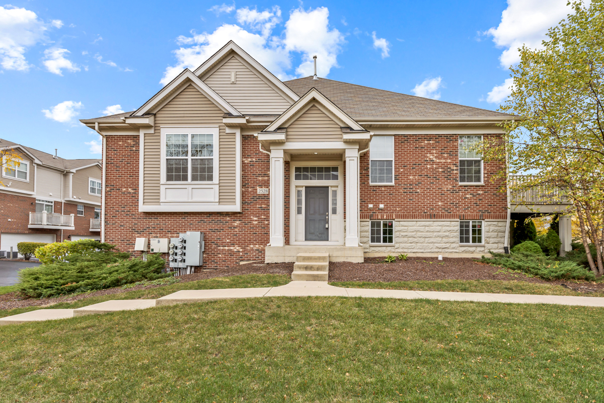 2528 Dunraven Avenue Naperville, IL 60540 - Photo 1 of 1 a front view of a house with a yard