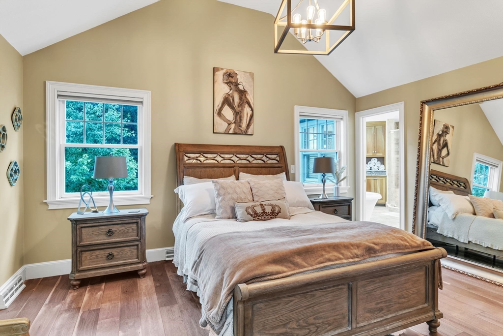 11 Echo Hill Road Wilbraham, MA 01095 - Photo 16 of 42 a bedroom with a bed and a wooden floor