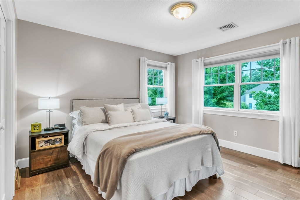 11 Echo Hill Road Wilbraham, MA 01095 - Photo 23 of 42 a bedroom with a bed and a large window