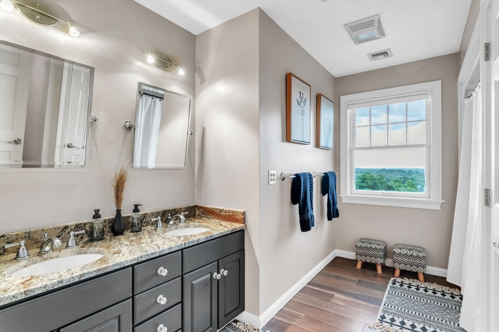 11 Echo Hill Road Wilbraham, MA 01095 - Photo 24 of 42 a en suite bathroom with a granite countertop sink and a mirror