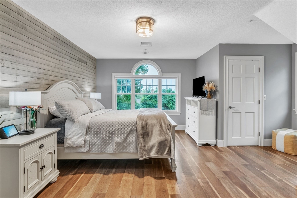 11 Echo Hill Road Wilbraham, MA 01095 - Photo 27 of 42 a bedroom with a bed and a large window