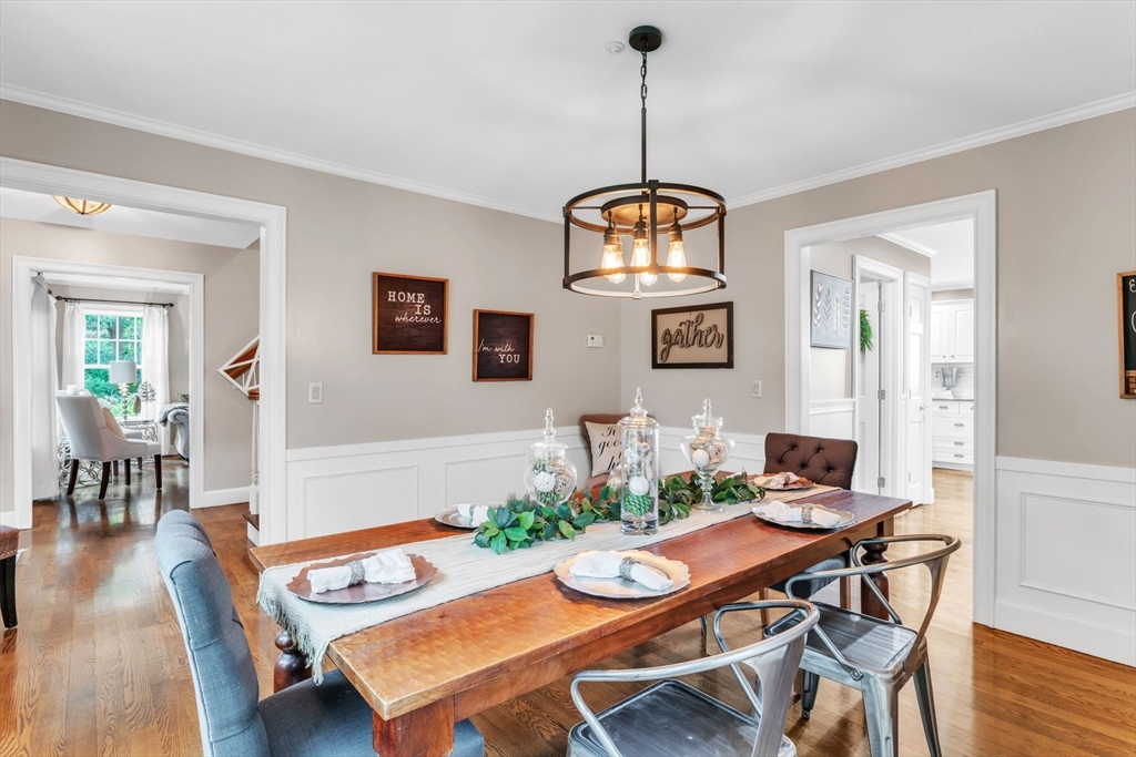 11 Echo Hill Road Wilbraham, MA 01095 - Photo 8 of 42 a view of a dining room with furniture wooden floor and chandelier