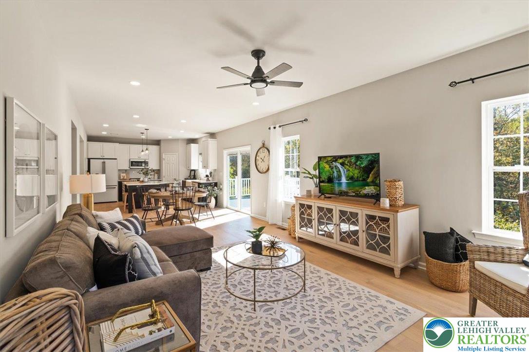 77 Tumble Creek Road, Unit 14 Easton, PA 18042 - Photo 16 of 32 a living room with furniture or couch and a flat screen tv