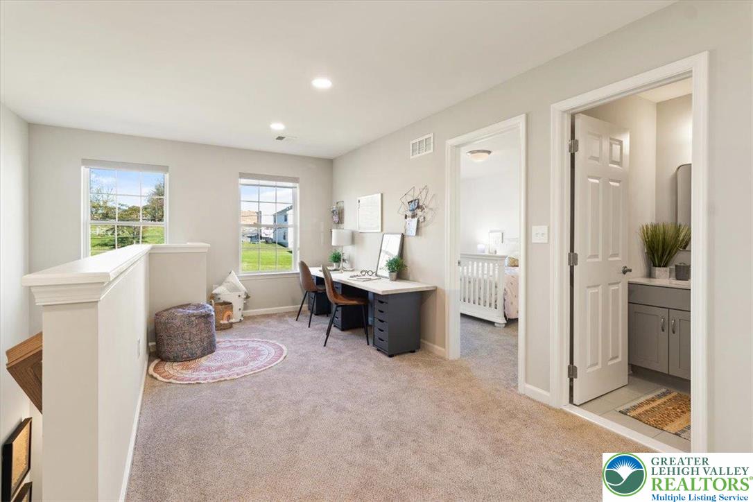 77 Tumble Creek Road, Unit 14 Easton, PA 18042 - Photo 18 of 32 a living room with furniture and a area