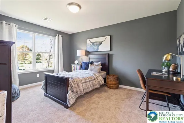 a bathroom with a sink a toilet a mirror and shower