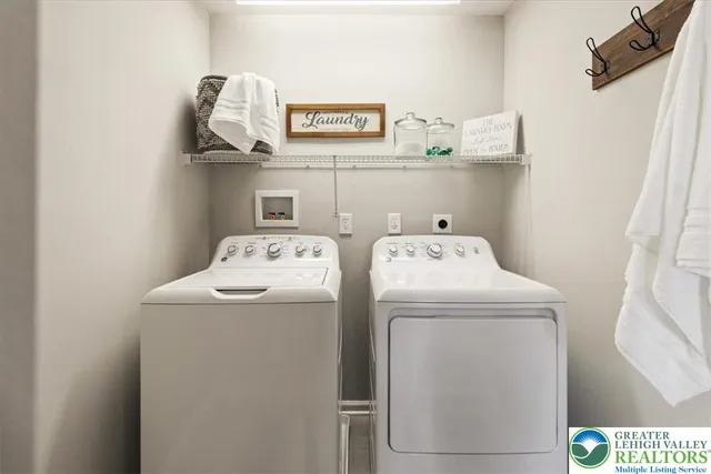a view of a bathroom with a tub and shower