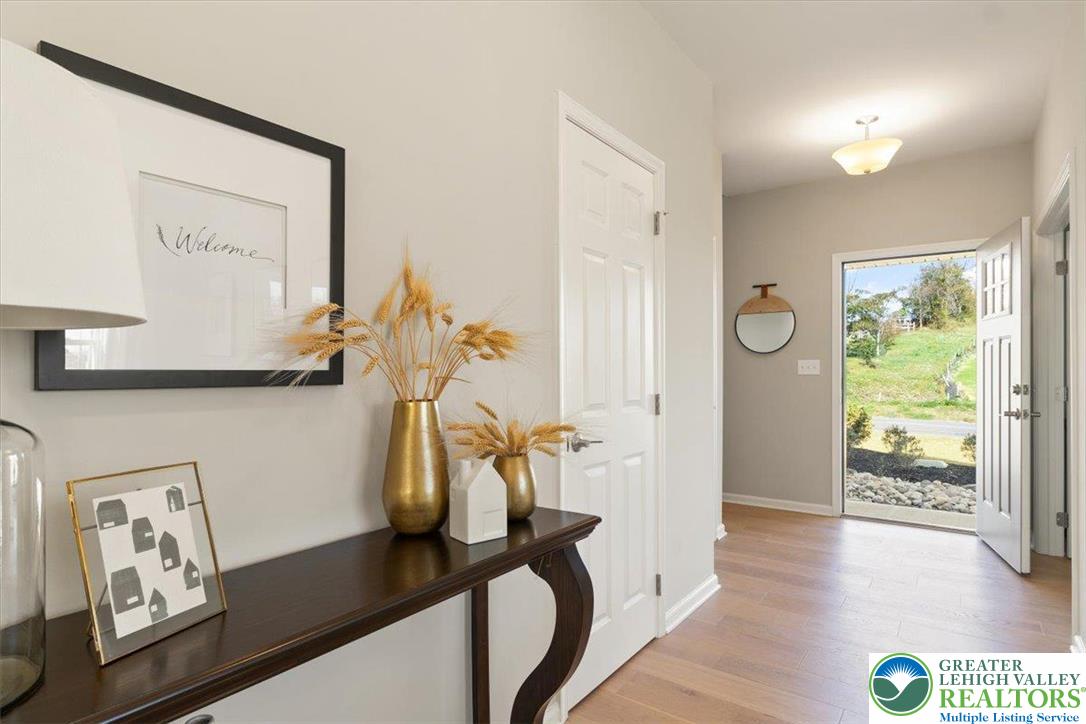 77 Tumble Creek Road, Unit 14 Easton, PA 18042 - Photo 5 of 32 a view of gym equipment with wooden floor and window
